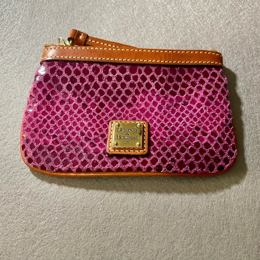 Dooney & Bourke Pink Clutch with Textured Surface and Zipper Closure
